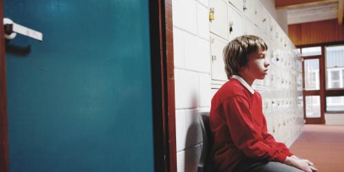 Student sitting outside of an office