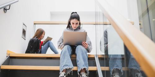 A student working on her laptop
