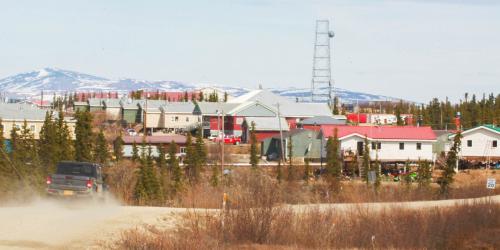 A car driving down a road in western Alaska